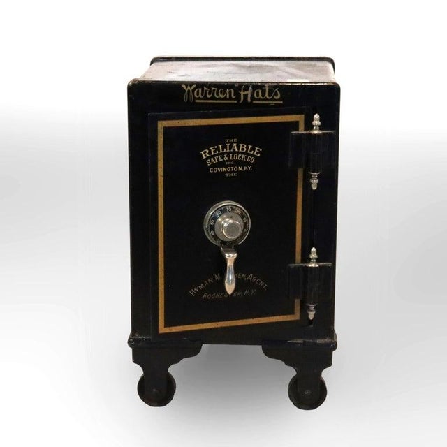 A cast iron safe, manufactured by The Reliable Safe & Lock Co. of Covington, Kentucky, dating to approximately 1890. The...