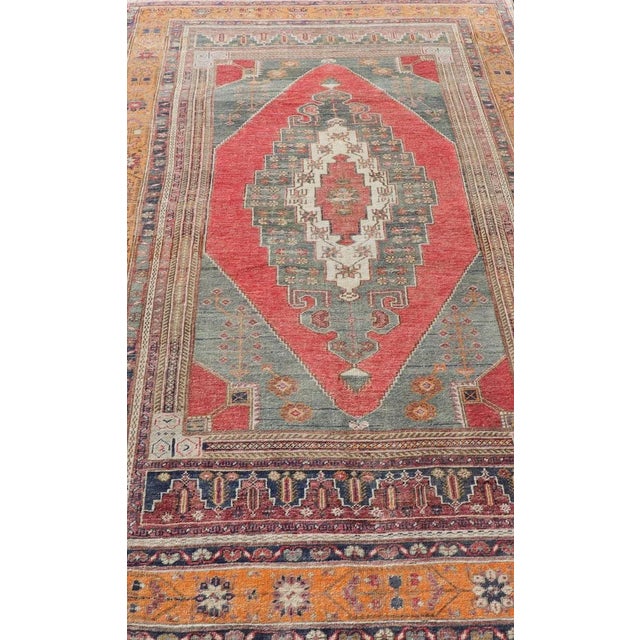 Measures: 5'7 x 9'11 Vintage Turkish Oushak Rug Medallion Design in Red, Gray, and Orange. Keivan Woven Arts / rug TU-...
