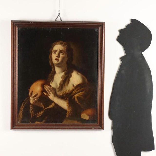 Oil on canvas, applied to a wooden plaque. The Saint is depicted in the foreground, half-length: the naked torso of the...