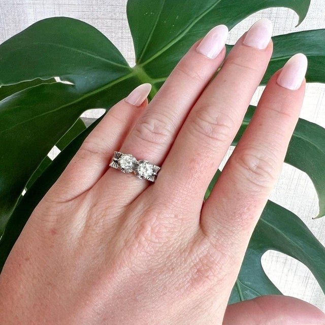 highly collectible post-war antique "Toi et Moi" (You and Me) ring (circa 1945). This French masterpiece is beautifully...