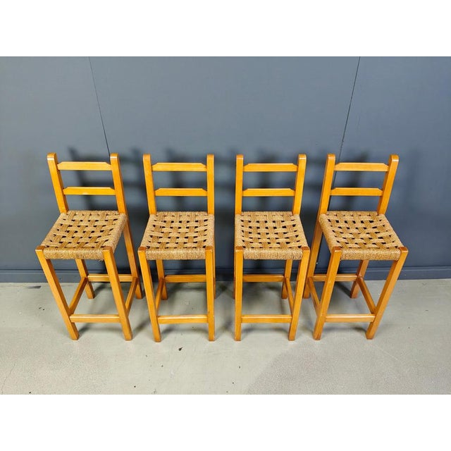 Rustic bar stools with oak frames and beautiful papercord seats. Very sturdy stools. Made in Belgium in the 1960s Very...