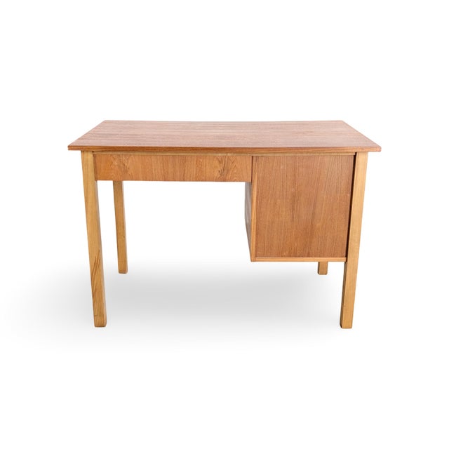 We are offering a beautiful vintage desk from the 1960s for sale. Made from high-quality teak and oak, the desk features...