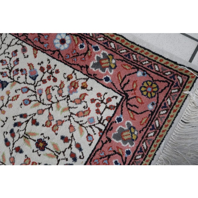 Transport yourself to a world of timeless elegance with our Vintage Indian Agra Rug, meticulously handcrafted in India...