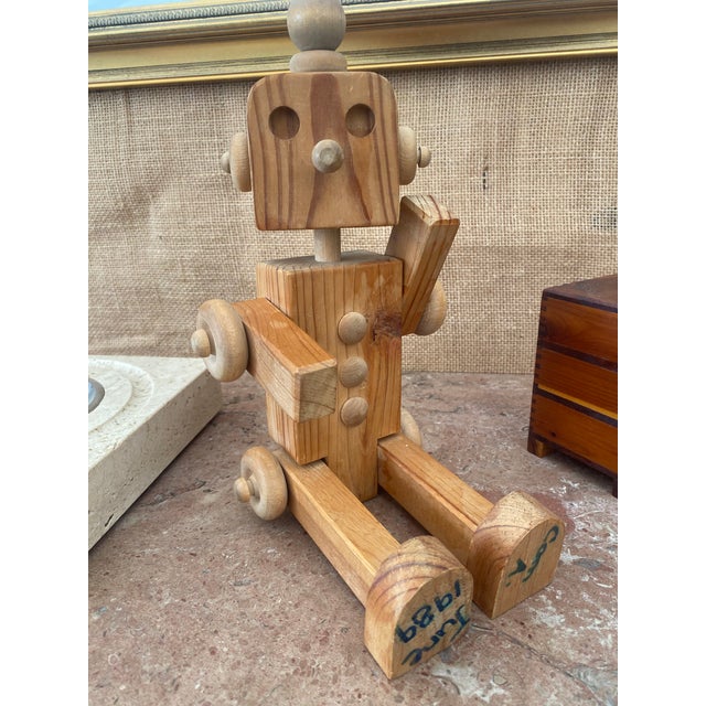 Carved wood, artist-made robot figure, complete with moveable arms, legs and head. He can even do the splits! Artist...