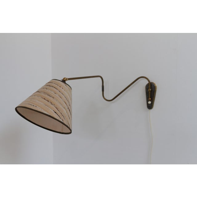 Danish Designer Articulating Brass Wall Light, Denmark 1940s. Scandinavian Mid-Century Modern adjustable brass wall light...