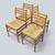 A beautifully crafted set of four mid-century Italian dining chairs combining solid beech ladderback frames with handwoven...