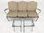 A rare and complete vintage Woodard wrought iron garden suite in the ivy leaf and vine pattern, comprising a three-seat...
