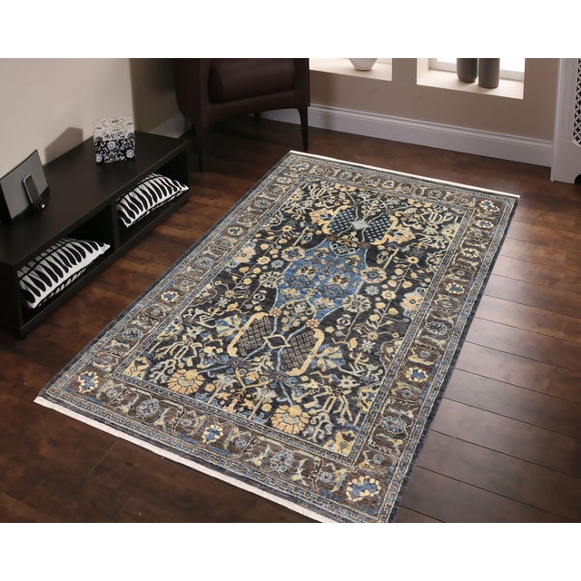 "Enhance the ambiance of your home with this magnificent Persian-influenced Turkish hand-knotted rug made by skilled...