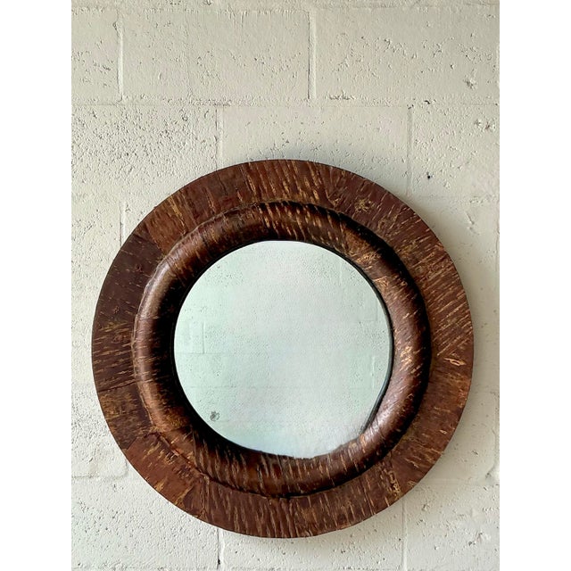 Introduce a rich, textural element to your walls with this exceptional vintage carved wood mirror. The substantial frame...