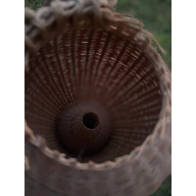 Vintage eel fish trap perfect as an accent piece. Natural color adds organic component to any room.