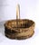 This is a rustic, hand made, oval wicker + wood shaving basket, featuring a vertical single swing handle. It has bound rim...