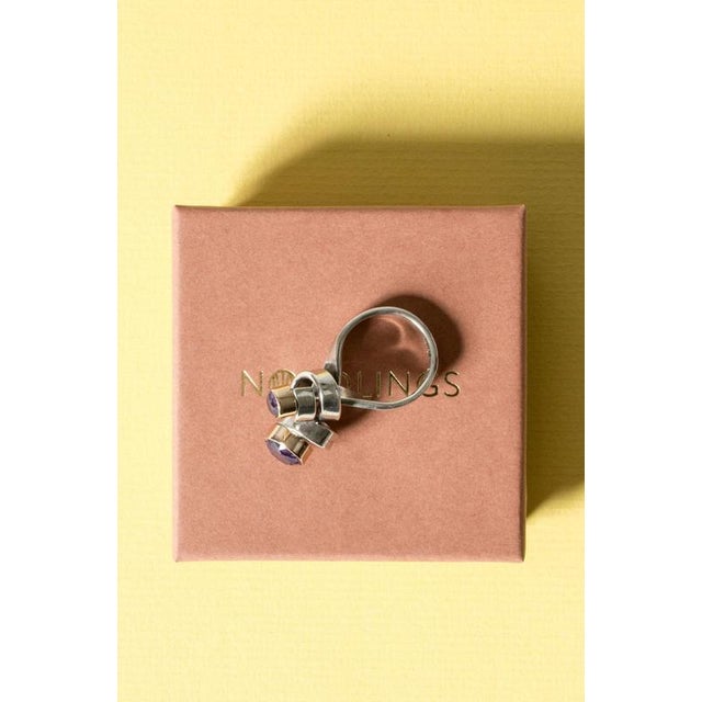 Amazing silver ring in an organic, lively and spiraling design by Cecilia Johansson. The spirals are finished with two...