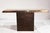 A beautiful 1970s console table combining a light travertine top with a patinated metal frame in coppery bronze tones. The...