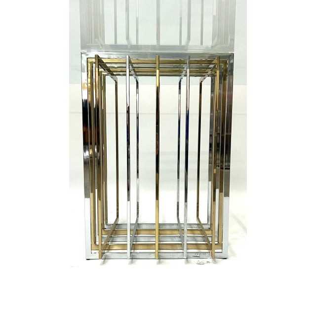Dining table by French designer Pierre Cardin, 1970s. Cage base in two-tone metal, steel, and polished brass. Clear square...