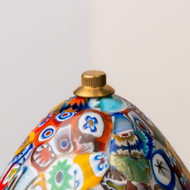 Egg-shaped table lamp crafted from Murano glass using the Millefiori-Murina technique. It features a multicolored pattern...