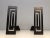 This pair is Modernist andirons is made or steel and wrought iron. The steel part presents a nice modernist design. This...