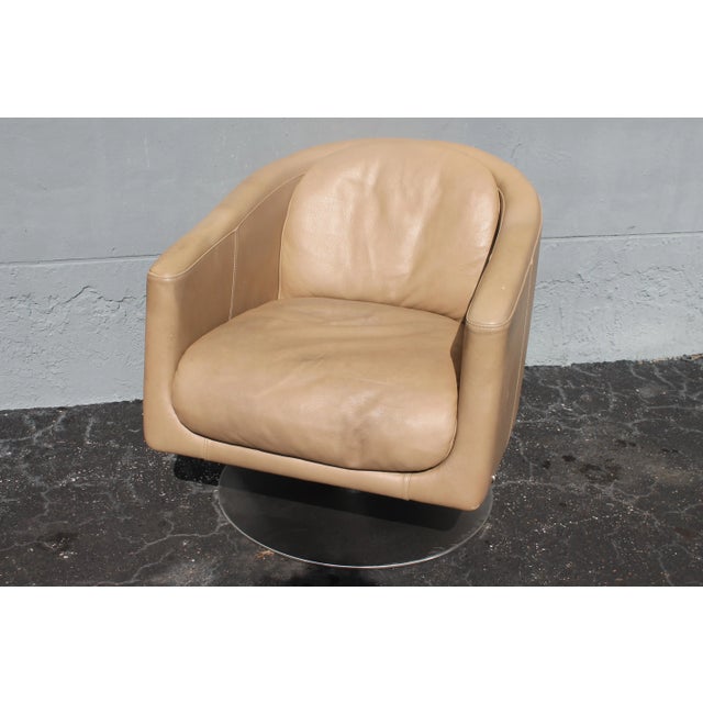 1960's Italian Art Deco style Leather Swivel Club Chair. Designer piece brown in color.