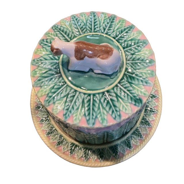 A wonderful Victorian-era majolica cheese dome/keeper. It has a beautiful upright leaf relief around the sides reminiscent...