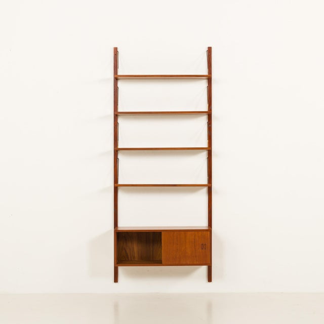 This danish teak shelving unit is reminiscent of the iconic 1960s modular furniture designed by poul cadovius and was...