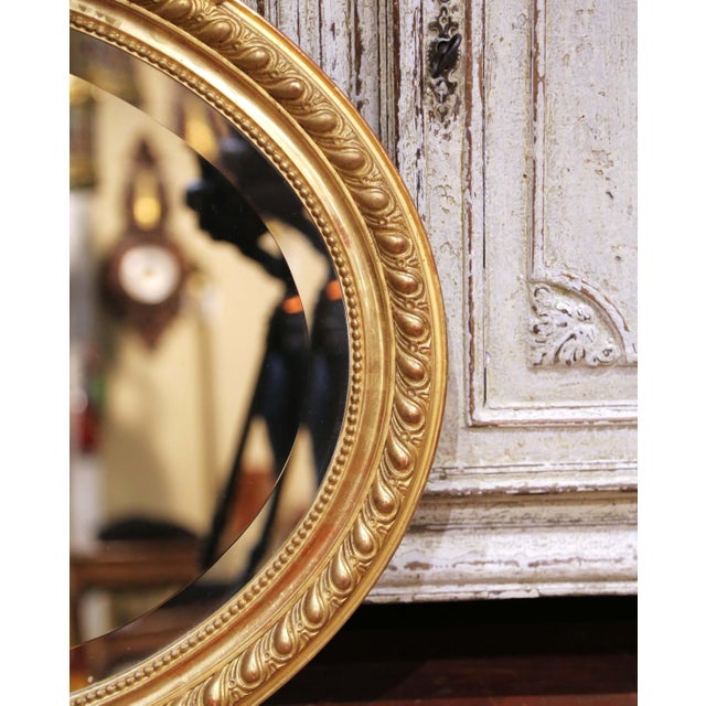 19th Century French Louis XV Oval Giltwood Wall Beveled Mirror With Crest For Sale - Image 4 of 7