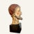 This wood, gesso and paint head of a santos of Judas Iscariot would have topped a procession figure that most likely was...