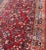 1920s Antique Sarouk Long Gallery Runner With All-Over Flower Design in Red Background For Sale - Image 5 of 12