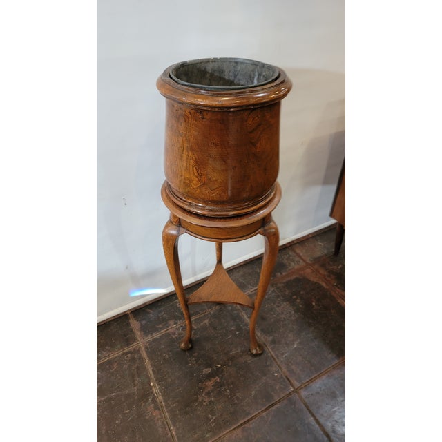A very nice oak plant stand Jardiniere style. Top is carved out of a log.