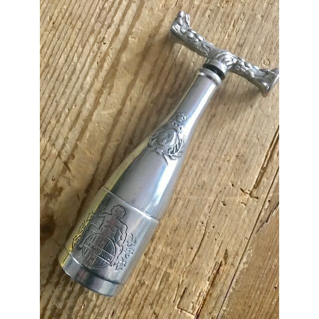 A beautiful pewter corkscrew in the shape of a wine barrel. Nice detail on the handle with grape and grapevine motif....