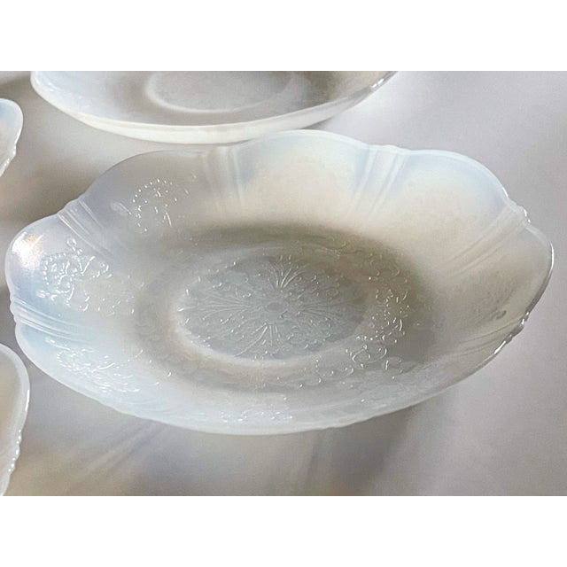 A set of four saucers in American Sweetheart pattern by the MacBeth-Evans Company dating from 1930 - 1936.