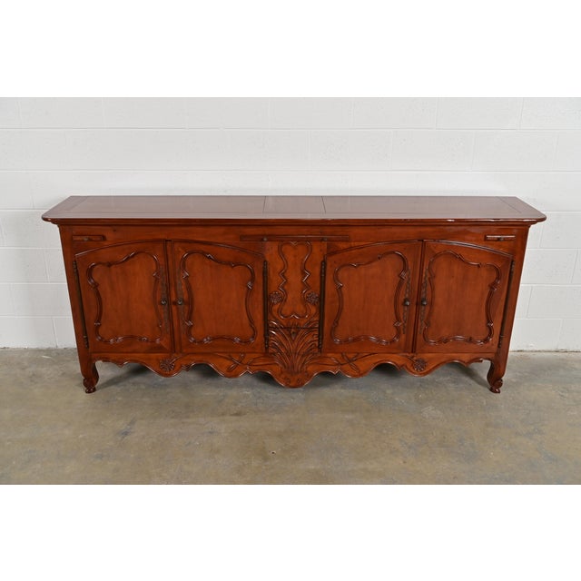 An exceptional French Country or French Provincial Louis XV style sideboard, credenza, or bar cabinet By Baker Furniture...