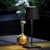 Battery-operated and rechargeable portable table lamp. The lamp features dimming touch control and has 3-CCT color...
