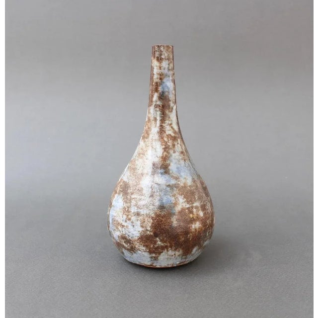 Mid-century ceramic flower vase by Alexandre Kostanda (circa 1960s). Stunning form in this earthenware vessel which...