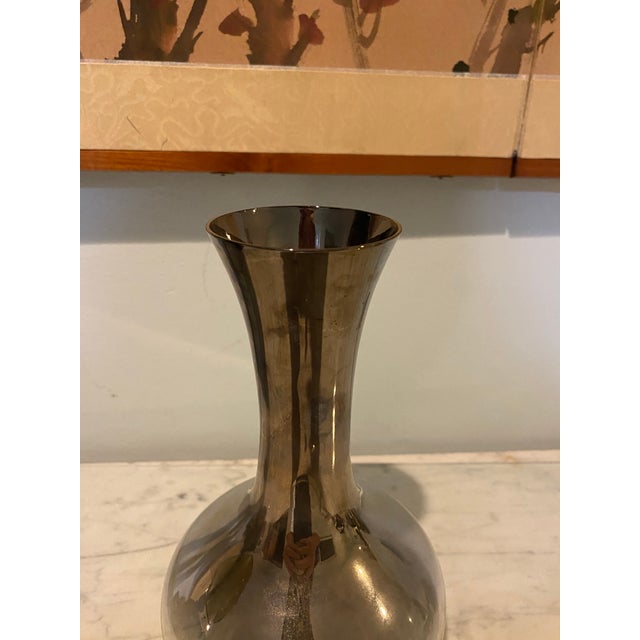 The perfect addition to any living room or dining room! The mid century design is perfect for displaying flowers on a bar...