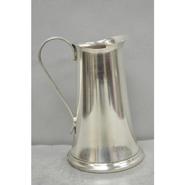 Vintage Sheffield USA Silver Plated Mid Century Modern Tapered Water Pitcher with Ice Lip. Circa Mid 20th Century....
