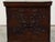 An English oak blanket chest from the late 18th century, with faux drawers and carved scrolls. Created in England during...
