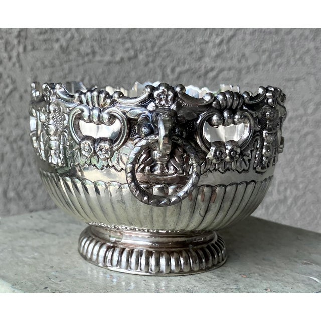 Excellent Pre-Owned Condition. With a hint of Old World elegance and charm, this repoussé-inspired silver plate over cast...