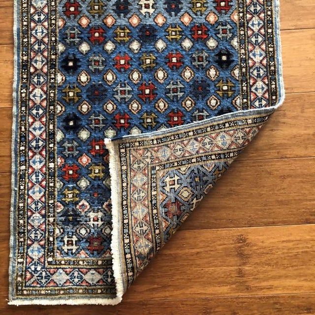 A small piece with remarkable presence, this rare vintage Khotan rug from East Turkistan captures the beauty of...