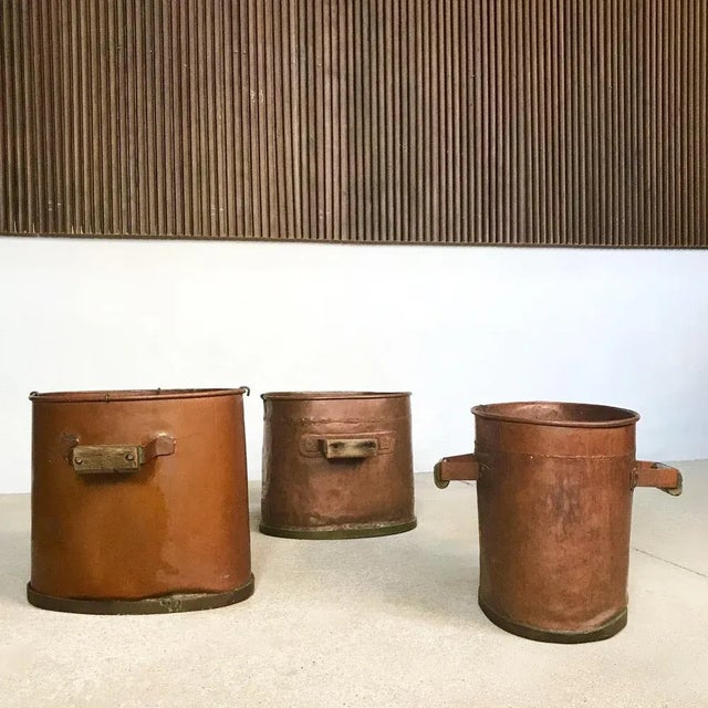 This set of three large antique copper log holders was hand-made in Germany around 1850. These heavy duty rustic pieces...