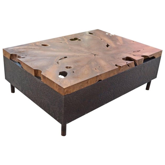 A single two inch reclaimed organic teak wood slab floats on a hammered metal base. Andrianna Shamaris. The Leader In...