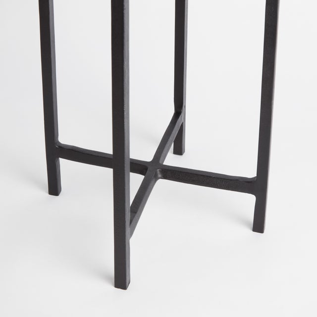 With a black bronze frame and a petite, thick glass slab, this accent table is made for modern living. Light enough to...