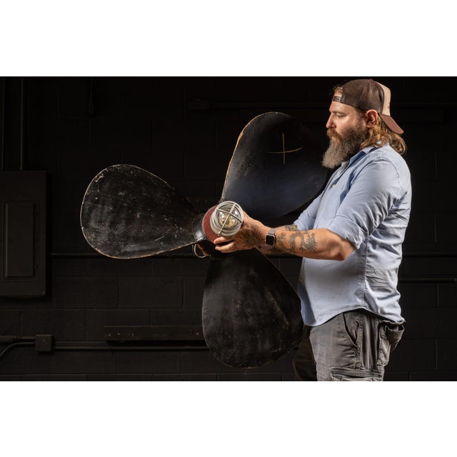 Early 20th-century salvaged ship propeller mold creatively repurposed as a ceiling-mounted pendant light. Originally used...
