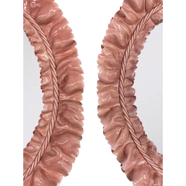 Two ceramic ruffled framed mirrors in a rose glaze. Attributed to Italian designer and sculptor Fausto Melotti circa 1950....
