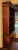Mid-20th century Chippendale style bookcase cabinet, English. Open bookcase with four adjustable shelves over pair of...