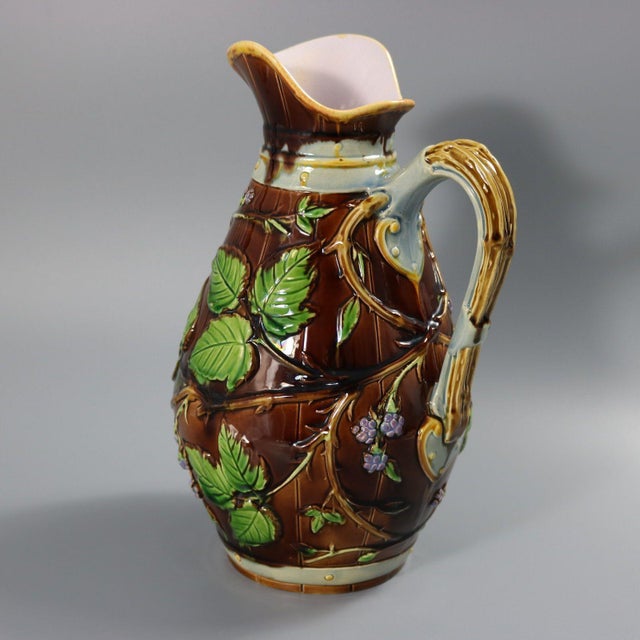 Minton Majolica jug/pitcher which features a blackberry bush bearing fruit. Barrel effect ground. Brown ground version....