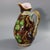 Minton Majolica jug/pitcher which features a blackberry bush bearing fruit. Barrel effect ground. Brown ground version....