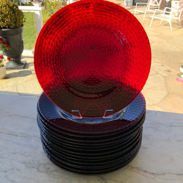 This set of ruby red dishware has various attributions: some reference it as the discontinued French Arcoroc Vercors Ruby...