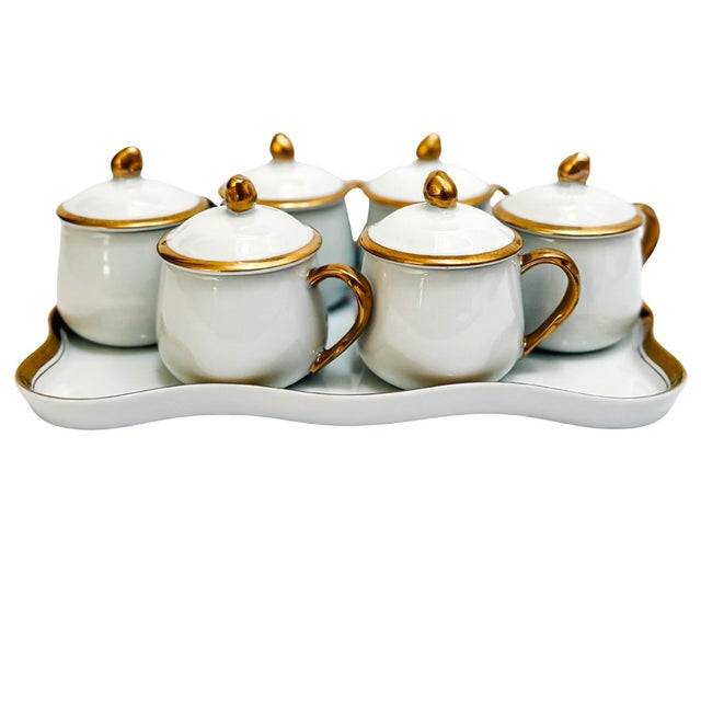 Complete set of six pots de creme with lids and matching scalloped serving tray. Each pot de creme features round handled...