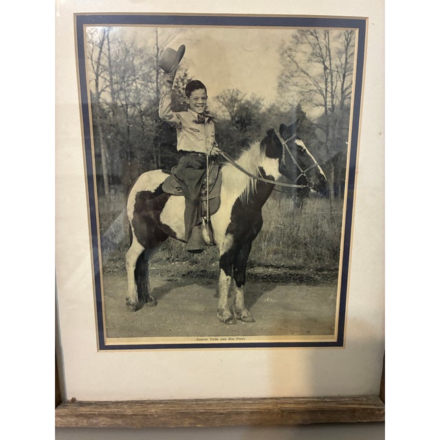 Capture the charm of the American West with this vintage black and white photograph titled "Justin Tubb and His Pony."...