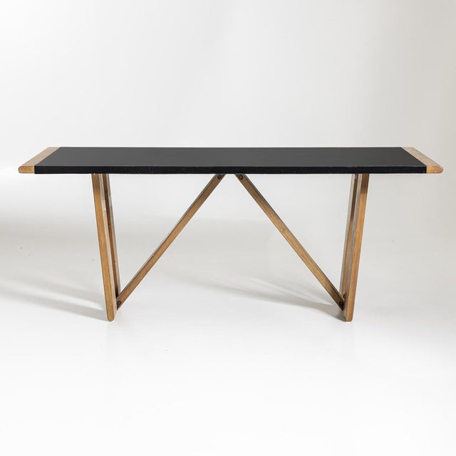 Large dining table by Roberto Pamio and Renato Toso on a W-shaped wooden frame with an ebonized table top. I have official...
