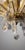 A stunning semi-flush Marie Theresa chandelier featuring a rich brass frame decorated with shimmering cut-crystal glass...